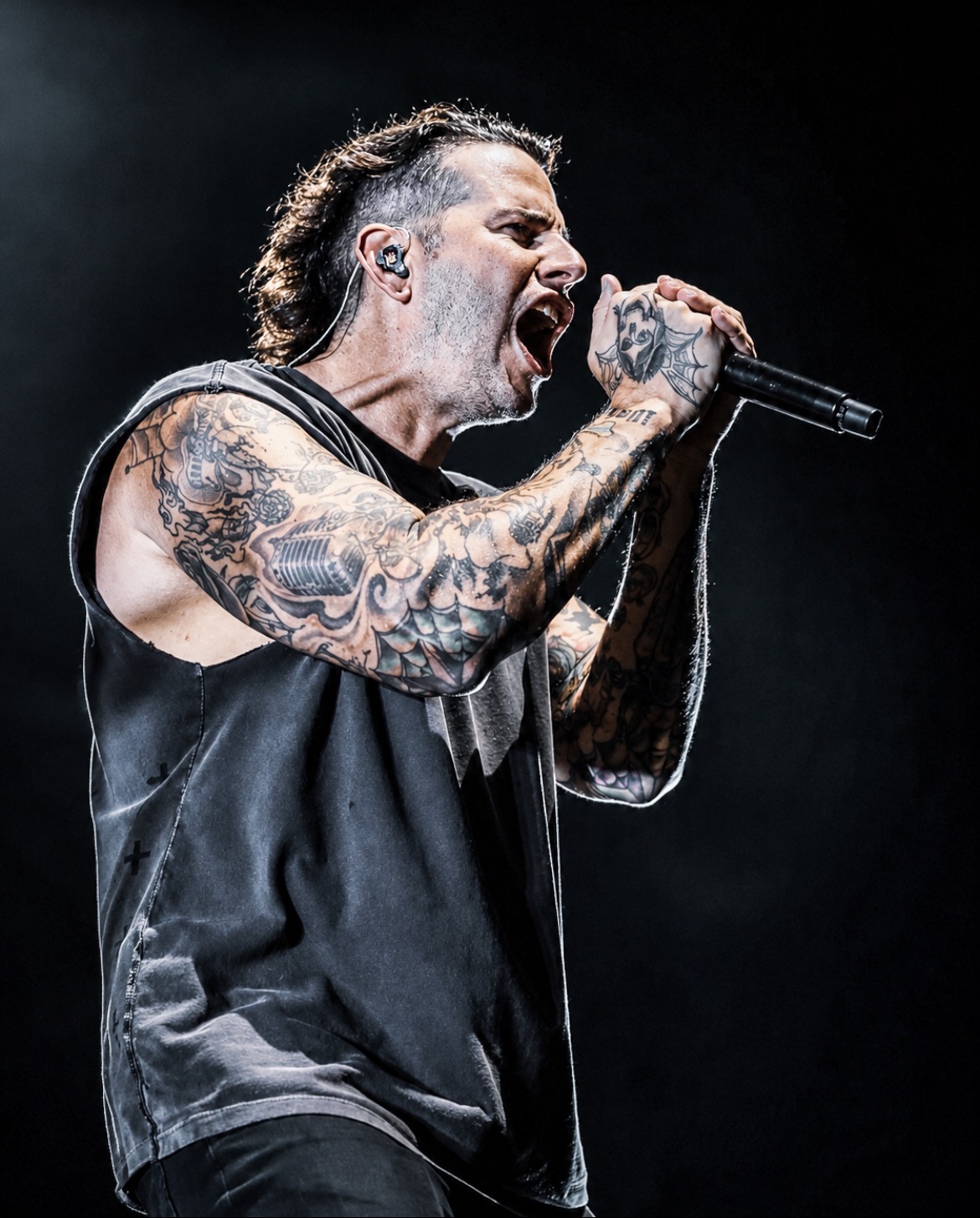 Avenged Sevenfold vocalist screaming into a microphone